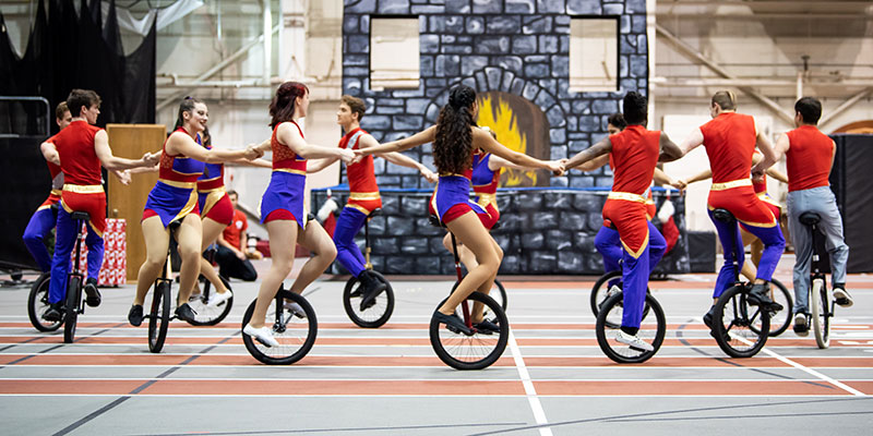Group of acrobatic on bicycles.